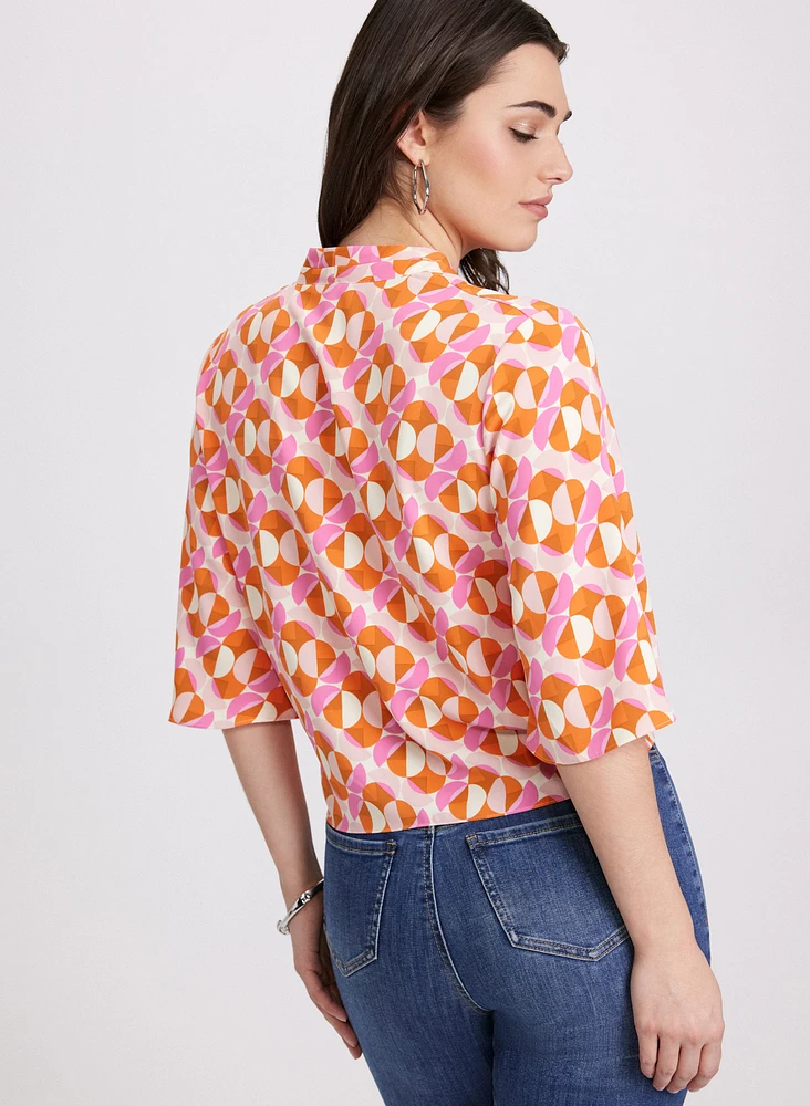 Blouse nouée à motif géométrique