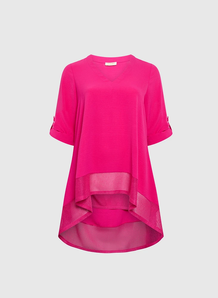 Blouse asymétriques à manches repliées