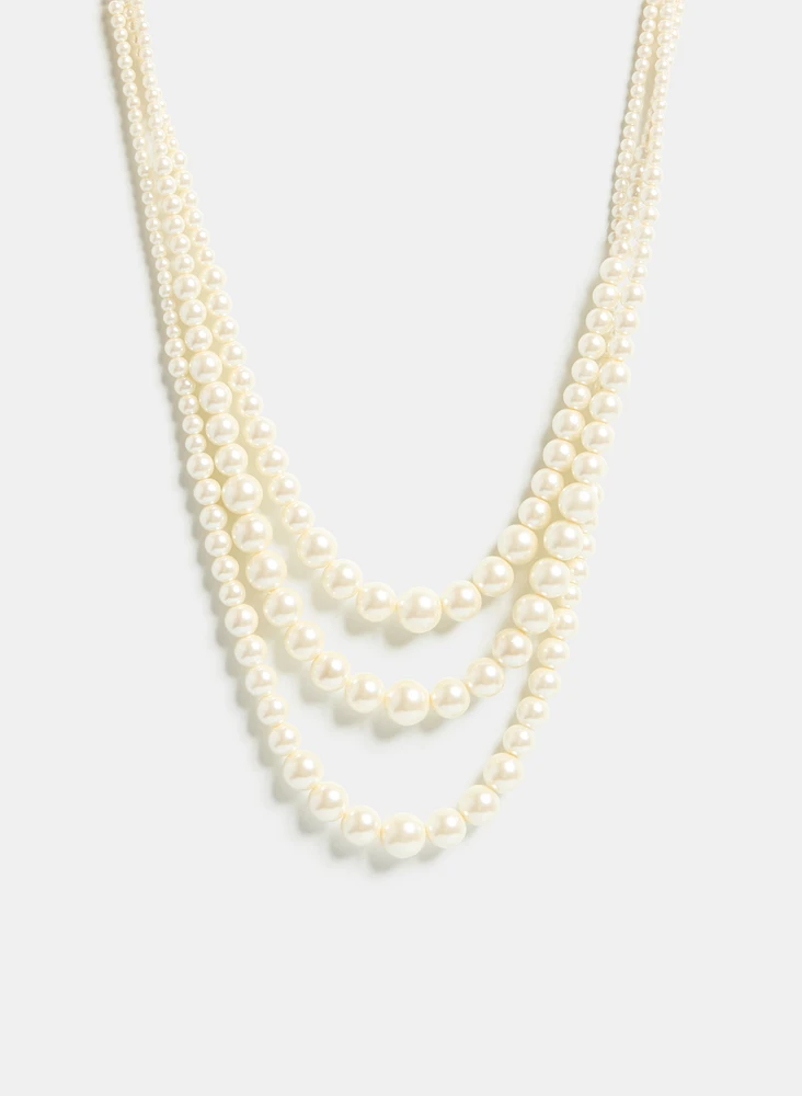 Collier à trois rangées de perles