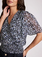 Blouse florale à manches évasées