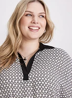 Blouse contrastante à motif géométrique