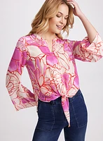 Blouse florale à ourlet noué