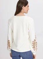 Haut à broderies ajourées