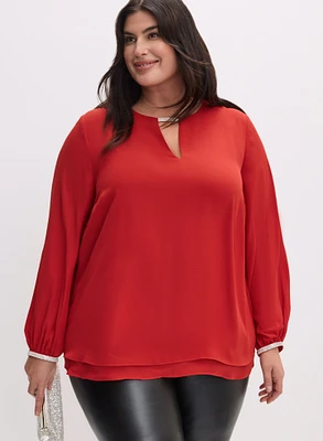 Blouse à découpe et détails en cristaux