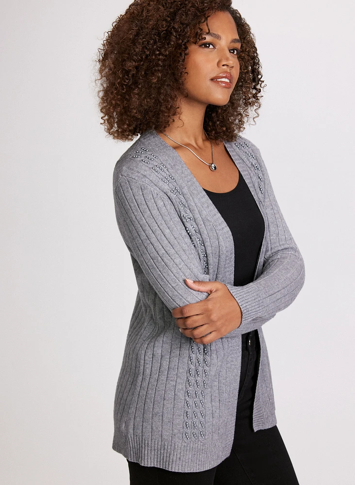 Cardigan à mailles torsadées et perles