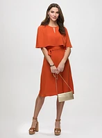 Robe cape et pochette de soirée