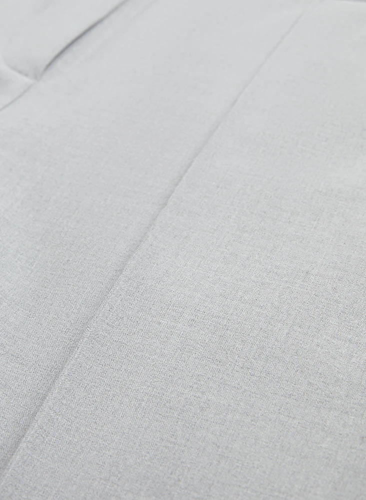 Pantalon coupe cité à jambe semi-évasée