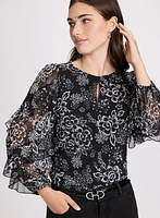 Blouse à motif floral et manches volantées