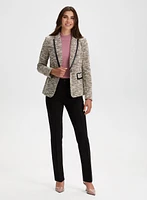 Blazer en tissu bouclé et détails faux cuir