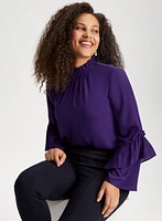 Blouse à col smocké et manches bouffantes