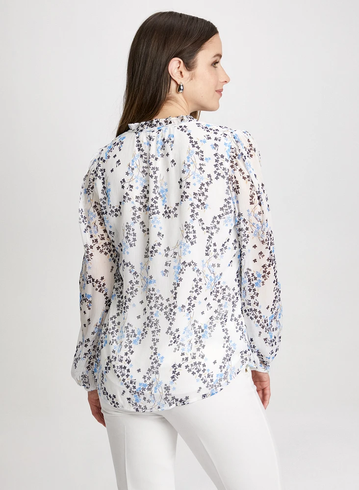 Blouse florale à col volanté