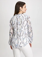 Blouse florale à col volanté