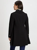 Manteau long et évasé en tricotine