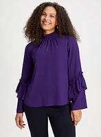 Blouse à col smocké et manches bouffantes