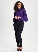 Blouse à col smocké et manches bouffantes