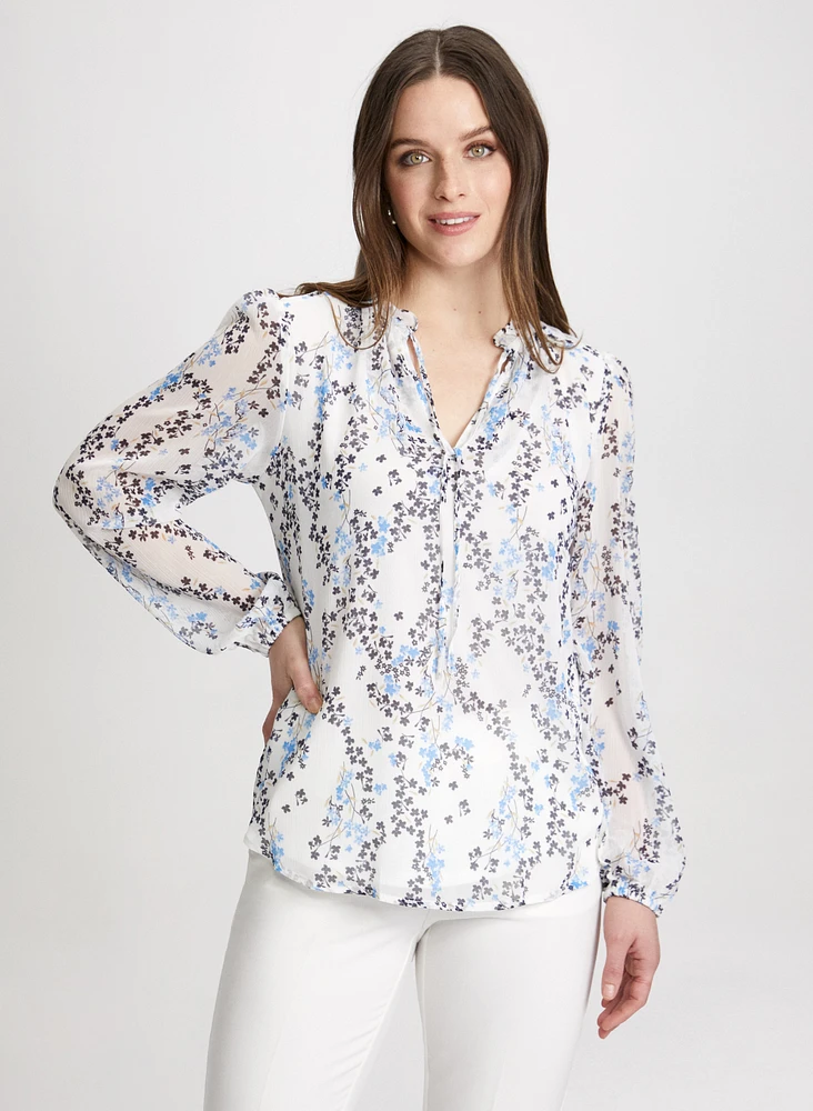 Blouse florale à col volanté