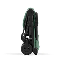Poussette Coya - Cadre noir mat avec siège vert feuillage