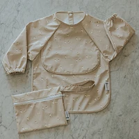 Long-sleeved Bib with integrated pocket 6-24m -Dogs