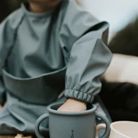 Long-sleeved Bib with integrated pocket 6-24m