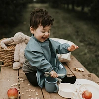 Long-sleeved Bib with integrated pocket 6-24m