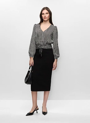 Blouse à motif vagué et manches ballon et jupe midi