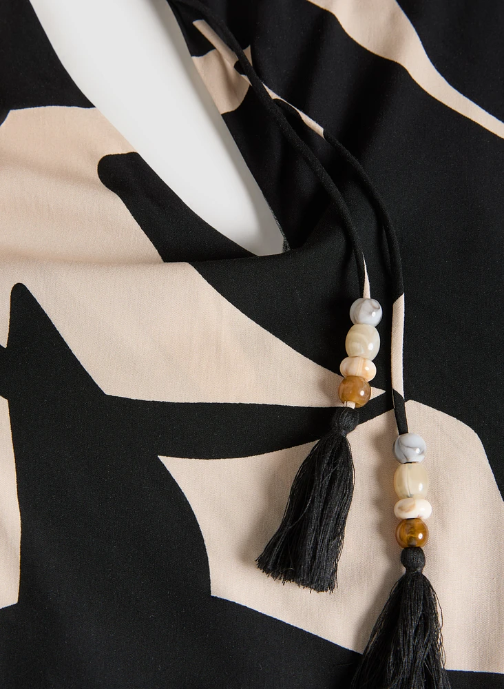 Robe asymétrique à motif de feuilles