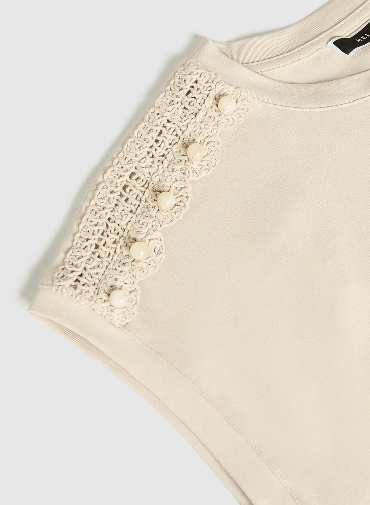 Haut à détail en crochet
