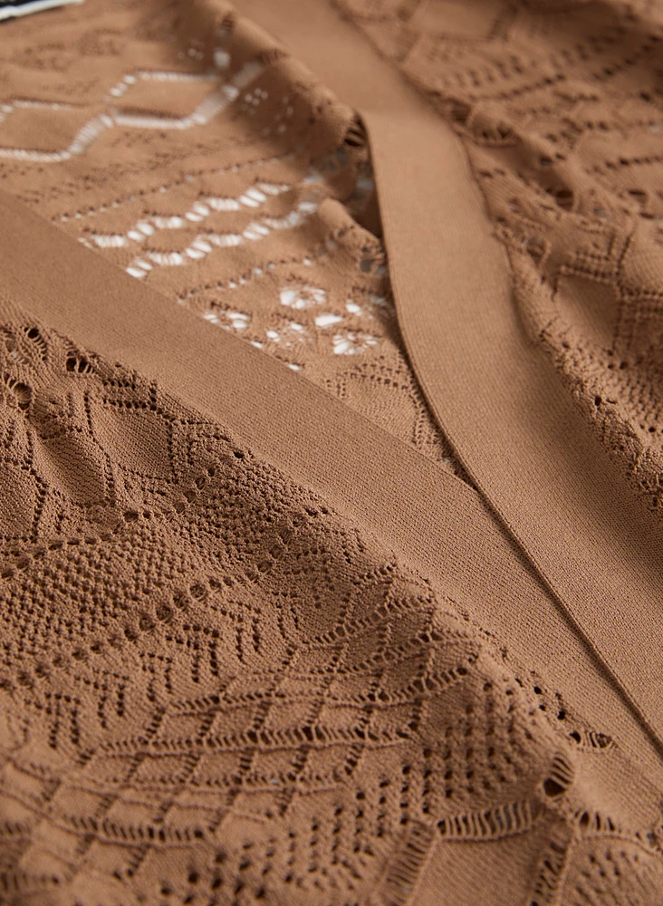 Boléro en tricot pointelle