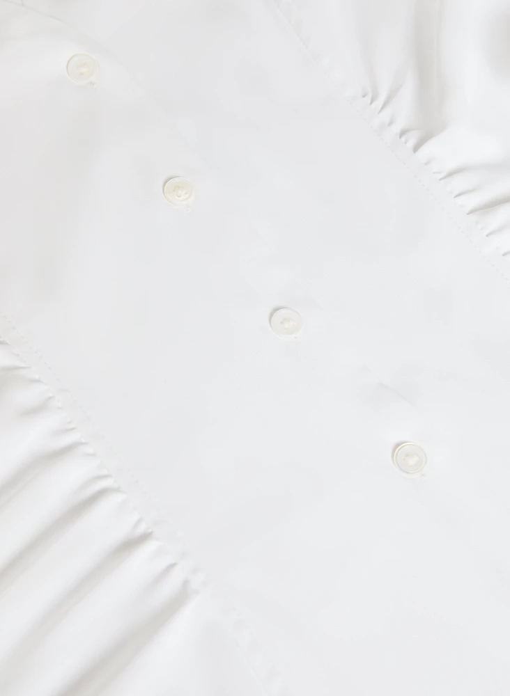 Blouse boutonnée à détails plissés
