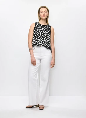 Blouse sans manches à pois et jean à jambe large