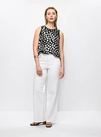 Blouse sans manches à pois et jean à jambe large