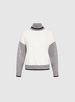 Pull à col roulé et paillettes
