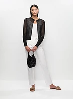 Cardigan en tricot avec chaîne et jean à taille haute