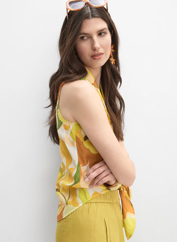 Blouse florale sans manches