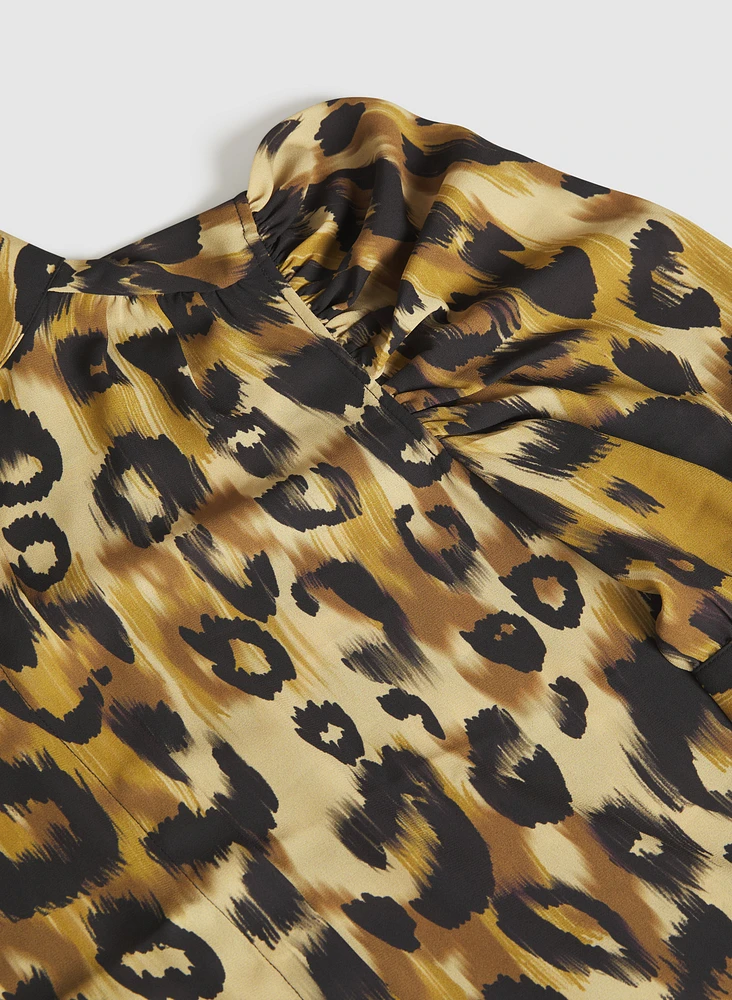 Blouse léopard à manches bouffantes