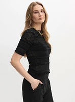 Pull à manches coude en tricot ajouré
