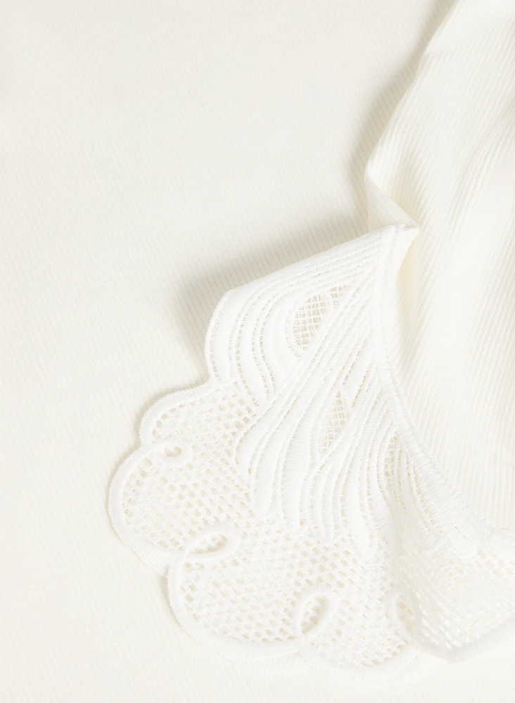 Haut à poignets en dentelle