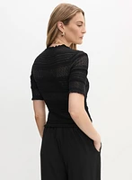 Pull à manches coude en tricot ajouré