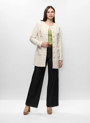Veste longue en tissu bouclé et jean à jambe large