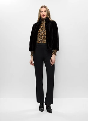 Manteau en fourrure végane et haut smocké