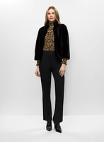 Manteau en fourrure végane et haut smocké