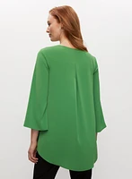 Haut asymétrique à effet superposé