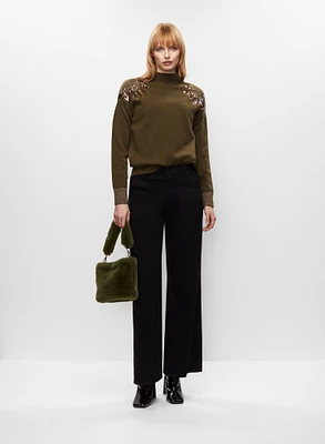 Pull pailleté et jean évasé