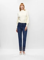 Pull en tricot pointelle et jean longueur cheville