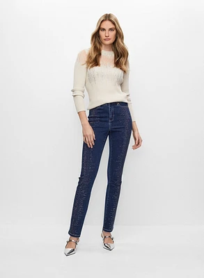 Pull à insert transparent et jean à strass