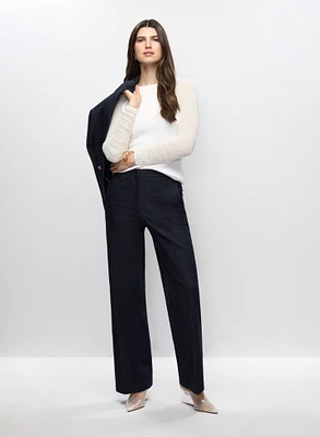 Veste en denim, pull en maille ouverte et pantalon jambe large