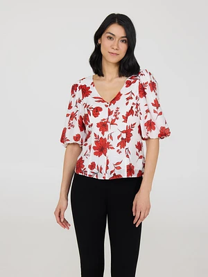 Haut fleuri à manches bouffantes et col en V