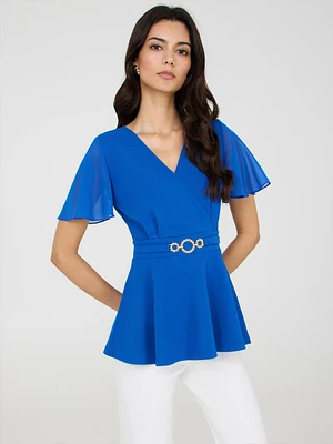 Haut péplum croisé avec ceinture métallique