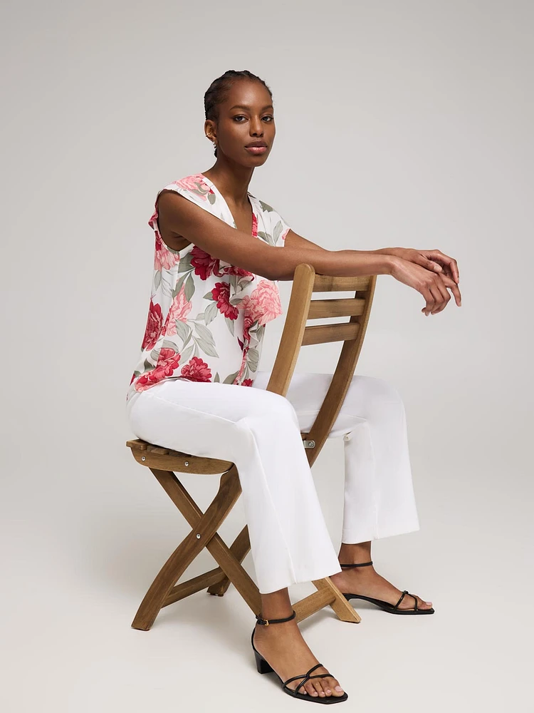 Blouse boutonnée sans manches à volants et motif fleuri