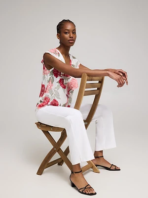 Blouse boutonnée sans manches à volants et motif fleuri